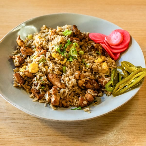 Peruvian chaufa with chicken, rice, egg, green onions, pickled red onions, and jalapeños.